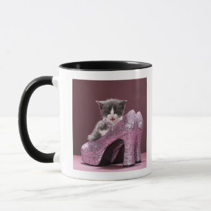 Kitten sitting in glitter shoes mug