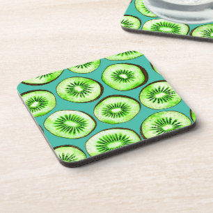 Kiwi slices on turquoise coaster