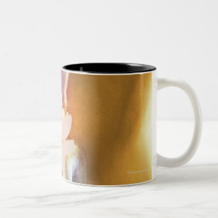 Knee replacement. Coloured X-ray of a total knee Two-Tone Coffee Mug