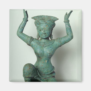 Kneeling feminine figure used to support a magnet