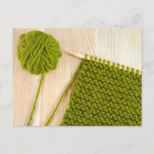 Knitting with green wool postcard