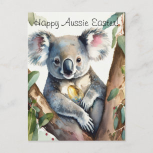 Koala bear holding a gold easter egg postcard