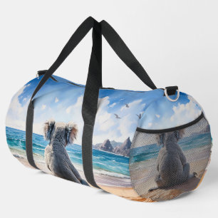Koala looking at the ocean duffle bag