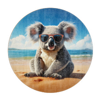 Koala on a sandy beach cutting board