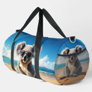 Koala on a sandy beach duffle bag