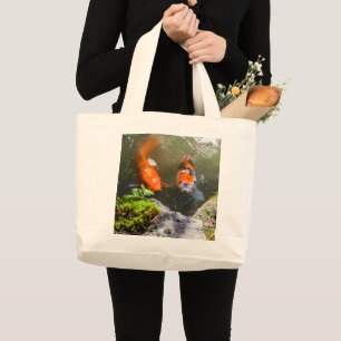 Koi fish in a pond large tote bag