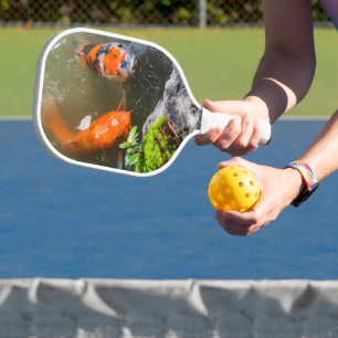 Koi fish in a pond pickleball paddle