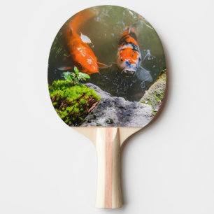 Koi fish in a pond ping pong paddle