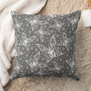 lace white butterflies on a grey polka dot cushion