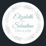 Lacy Silver Border Elegant Teal & White Wedding Classic Round Sticker<br><div class="desc">These elegant wedding stickers feature fancy teal,  turquoise or aqua coloured script text on a classic white background with a lacy silver faux foil floral border. The text is fully customisable and contains the wedding couple's names and wedding date. Great as favour tags or envelope seals!</div>