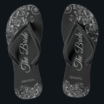 Lacy Silver on Black Elegant The Bride Wedding Thongs<br><div class="desc">Dance the night away with these beautiful wedding flip flops. Designed for the bride, they feature a simple yet elegant design with grey script lettering on a classic black background and fancy silver grey decorative curls and swirls. Beautiful way to stay fancy and appropriate while giving your feet a break...</div>