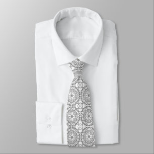 Lacy white squares on a light grey background tie