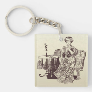 lady drinks tea key ring