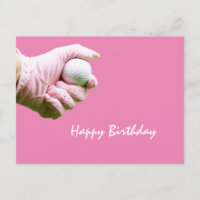 Lady golfer hold golf ball with pink glove on pink
