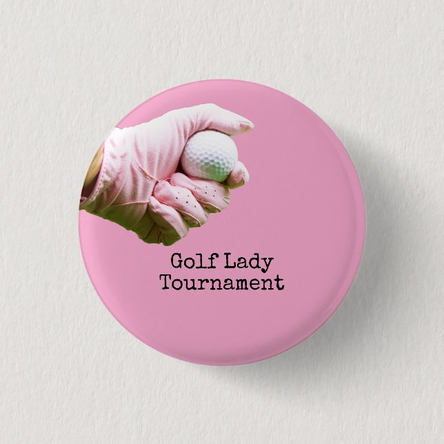 Lady golfer is holding golf ball on pinkbackground 3 cm round badge (Front)