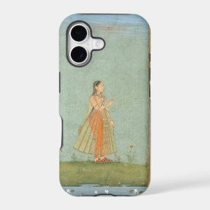 Lady holding a flower, standing by a lily pond, fr
