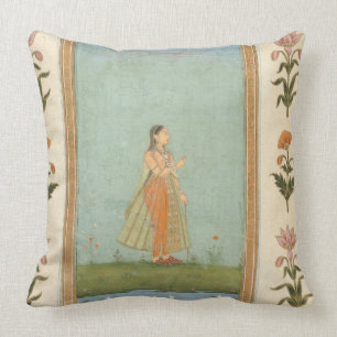 Lady holding a flower, standing by a lily pond, fr cushion