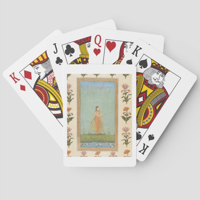 Lady holding a flower, standing by a lily pond, fr playing cards (Back)