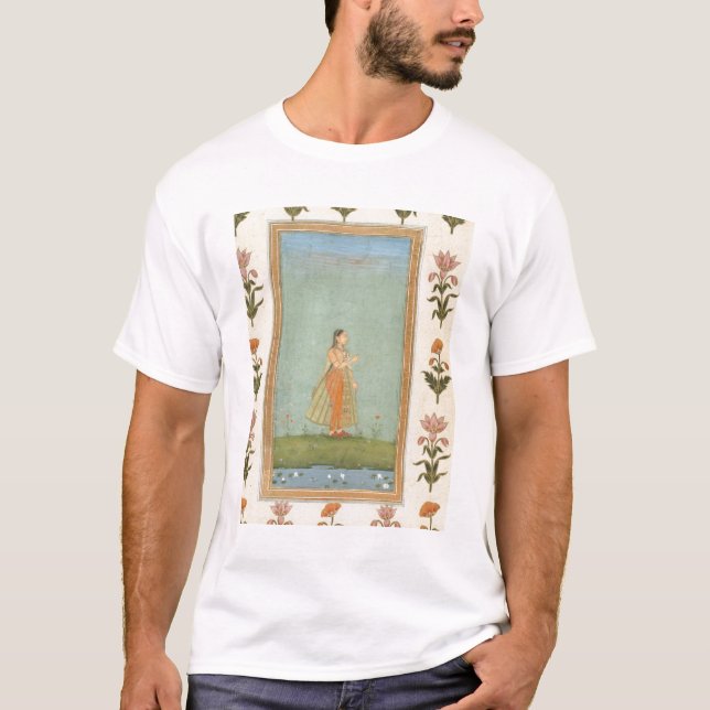 Lady holding a flower, standing by a lily pond, fr T-Shirt (Front)