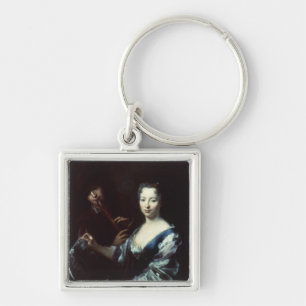 Lady playing a spinet and a flautist key ring