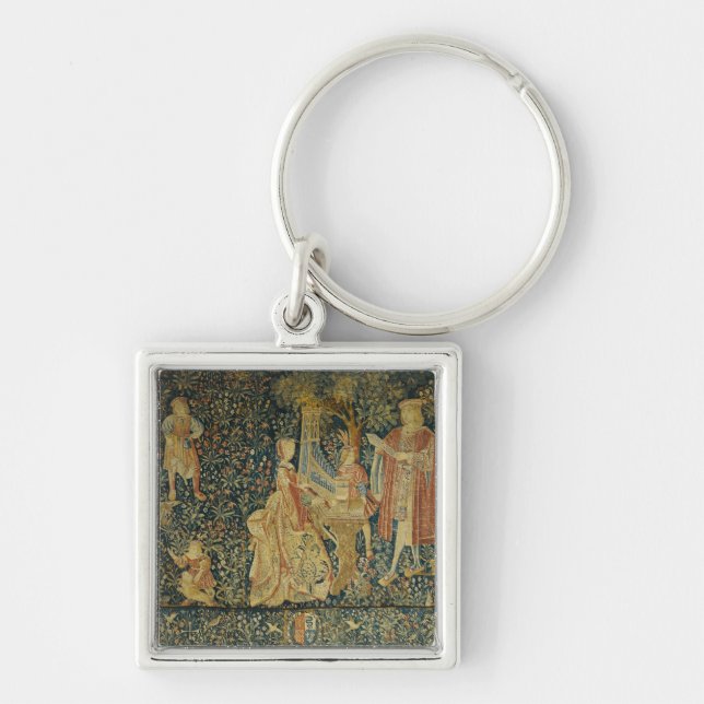 Lady playing the portative organ from key ring (Front)