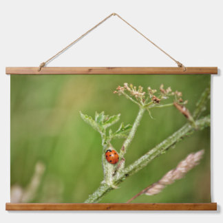 Ladybug on a green plant hanging tapestry