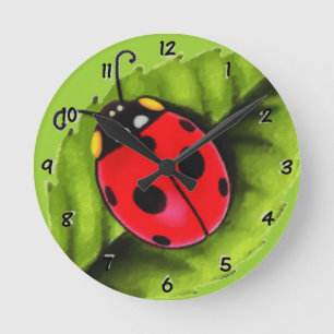 Ladybug on a Leaf Round Clock