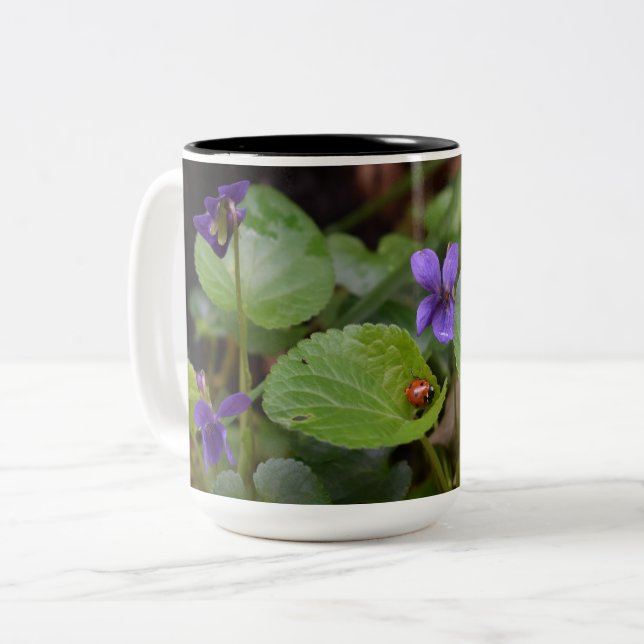 Ladybug on Sweet Violet Flowers Two-Tone Coffee Mug (Front Left)
