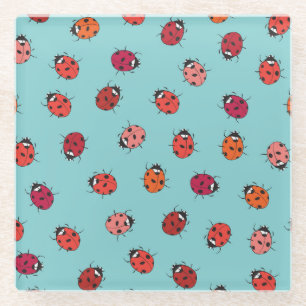 Ladybugs, blue background, charming seamless patte glass coaster