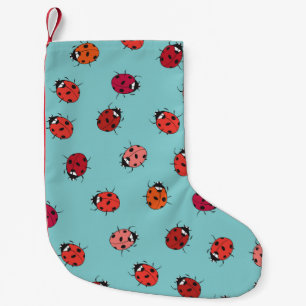 Ladybugs, blue background, charming seamless patte small christmas stocking