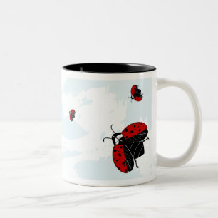 ladybugs in flight Two-Tone coffee mug