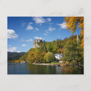 Lake Bled with trees in autumn colours in Slovenia Postcard