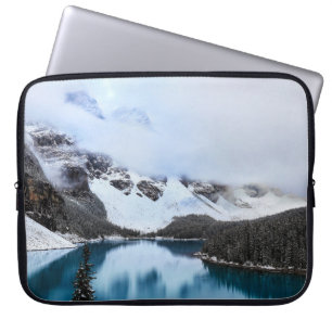 LAKE NEAR SNOW COVERED MOUNTAIN DURING DAYTIME LAPTOP SLEEVE