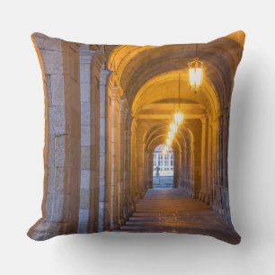 Lamp lit stone hallway, spain cushion