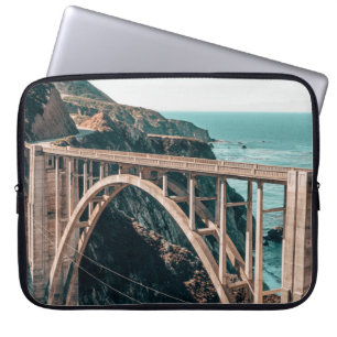 LANDSCAPE PHOTOGRAPHY OF GRAY CONCRETE BRIDGE LAPTOP SLEEVE