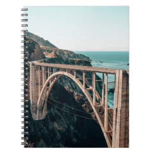 LANDSCAPE PHOTOGRAPHY OF GRAY CONCRETE BRIDGE NOTEBOOK