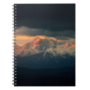 LANDSCAPE PHOTOGRAPHY OF SNOW MOUNTAINS UNDER NIMB NOTEBOOK