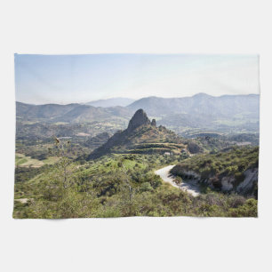landscape with large rock formation Cyprus Tea Towel