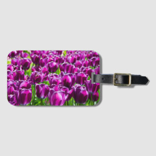 Large field of purple tulips    luggage tag