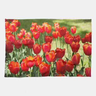 Large field of red tulips tea towel