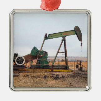 Large Green Pumpjack in an Oil Field Metal Ornament