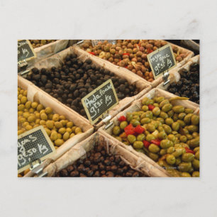 Large open boxes of black and green olives for postcard