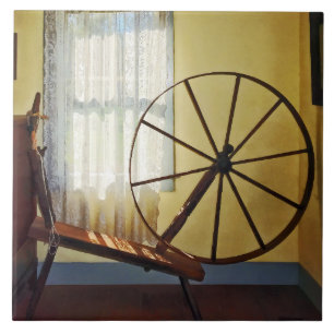 Large Spinning Wheel Near Lace Curtain Ceramic Tile