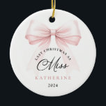 Last Christmas as a Miss Pink Bow Ceramic Ornament<br><div class="desc">Celebrate your final Christmas as a Miss with this elegant, minimalistic ornament. Featuring a chic pink bow and sophisticated fonts, this ornament is perfect for brides-to-be as they prepare for their next chapter. Hang it proudly on your tree as a beautiful reminder of your engagement season and the magical moments...</div>