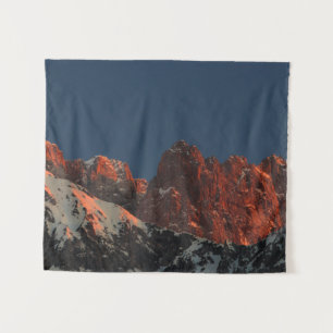 Last light of sun on mountains tapestry