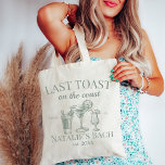 Last Toast On The Coast Beach Bachelorette Party Tote Bag<br><div class="desc">Capture the essence of coastal elegance with our Last Toast On The Coast Beach Bachelorette Party Tote Bag – the perfect blend of functionality and style for your beach bachelorette celebration. This tote bag goes beyond ordinary accessories; it's a symbol of personalised luxury, making it an ideal addition to your...</div>