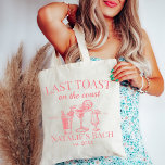 Last Toast On The Coast Beach Bachelorette Party Tote Bag<br><div class="desc">Elevate your beach bachelorette experience with our Last Toast On The Coast Beach Bachelorette Party Tote Bag – the perfect combination of functionality and style for your coastal celebration. This tote bag goes beyond ordinary accessories; it's a symbol of personalised luxury, making it an ideal addition to your beach bachelorette...</div>