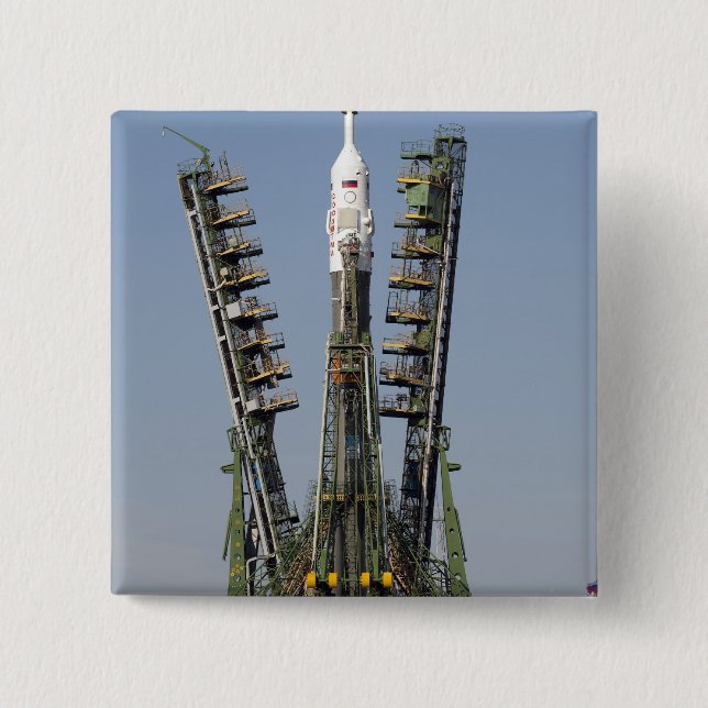 Launch scaffolding is raised into place 15 cm square badge (Front)