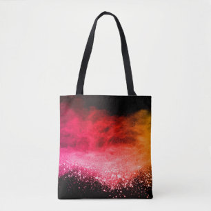 Launched colorful powder, isolated on black backgr tote bag