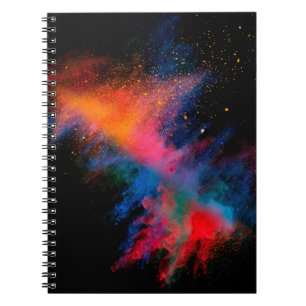 Launched colourful powder on black backgroundcolor notebook